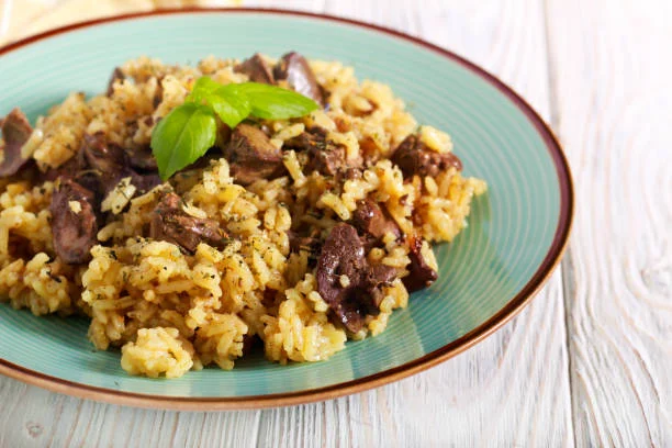 طريقة عمل طاجن الأرز بالكبدة.. وصفة سهلة وسريعة بطعم شهي على طريقة الشيف مي صيام 1 طريقة عمل طاجن الأرز بالكبدة.. وصفة سهلة وسريعة بطعم شهي على طريقة الشيف مي صيام