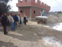 إزالة تشوين مواد بناء خارج الحيز العمراني بالقناطر الخيرية ومصادرة المضبوطات